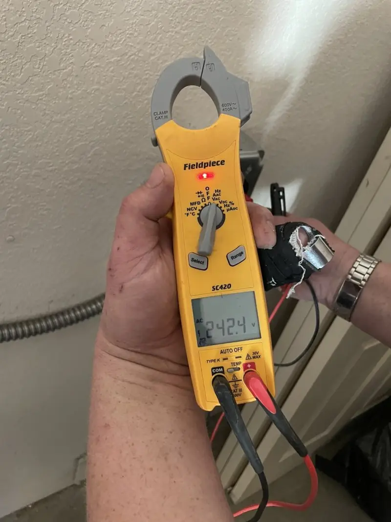 Voltage testing with clamp meter during Electrical Installation Services in Seven Lakes